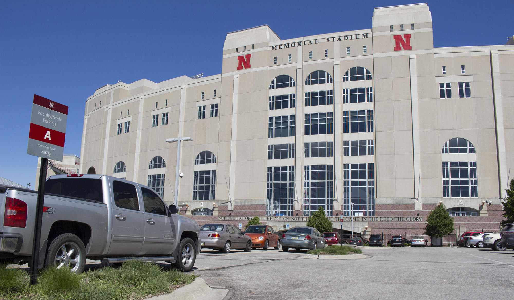 Image of vehicle parked in a designated parking lot by the Memorial Stadium