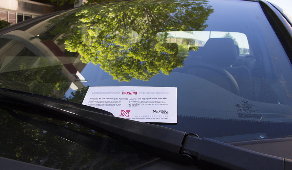 Image of parking ticket on car windshield